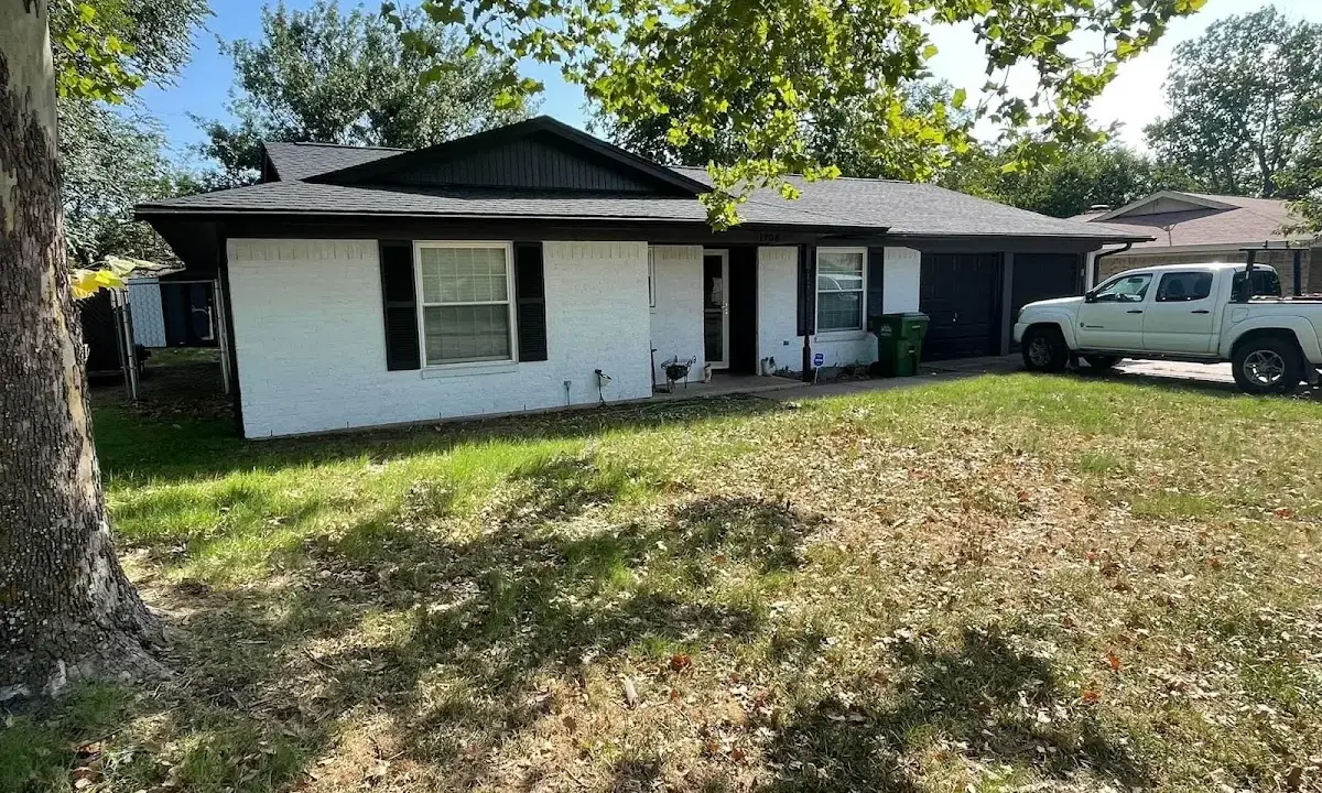 Professional roofing crew working on a residential roof in Marlborough
